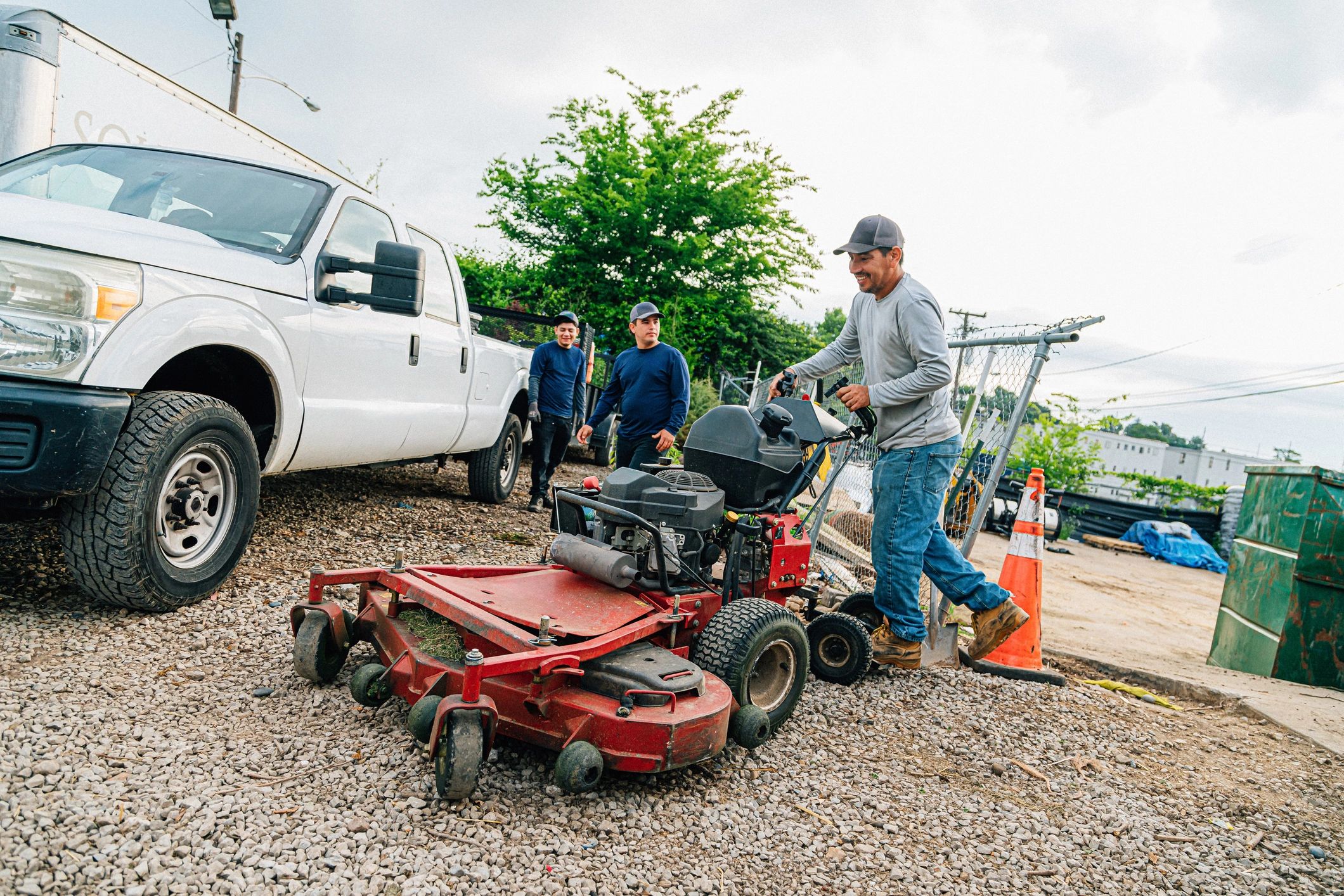 Landscaping crew loading equipment for lawn care service